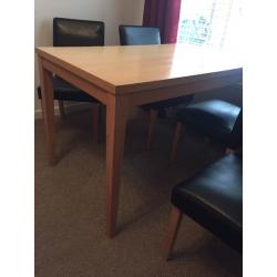 Dining room table and four faux leather chairs