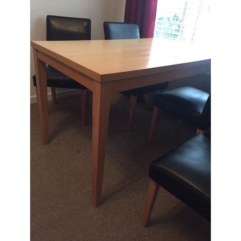 Dining room table and four faux leather chairs