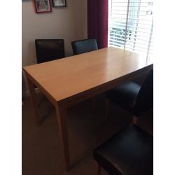 Dining room table and four faux leather chairs