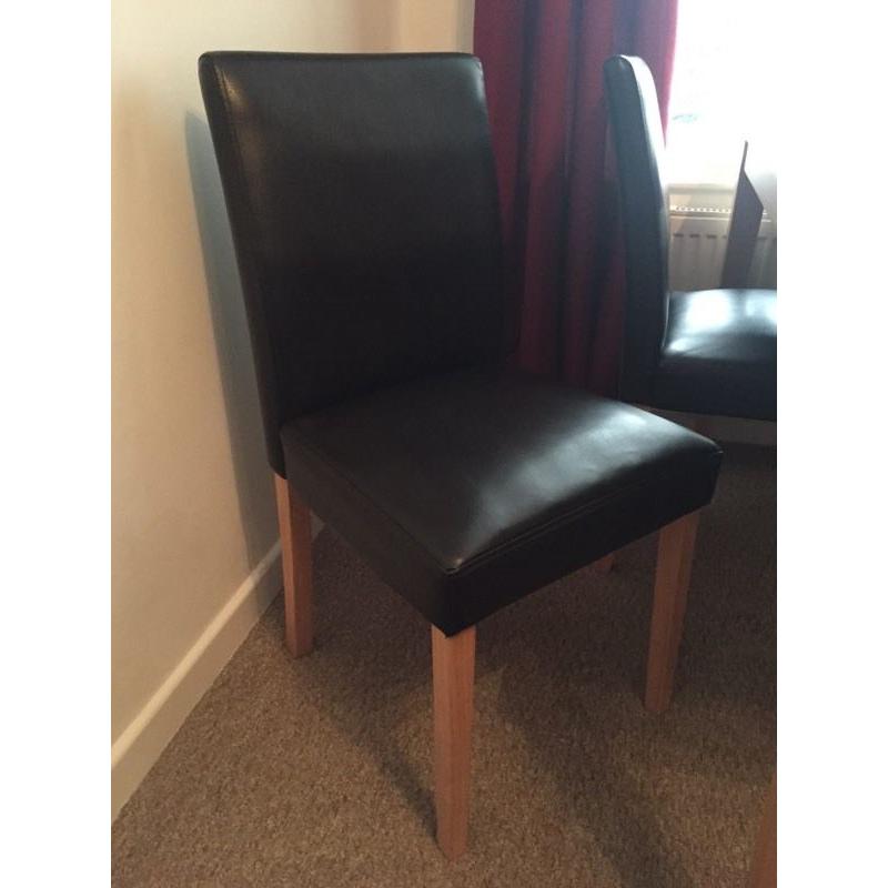 Dining room table and four faux leather chairs