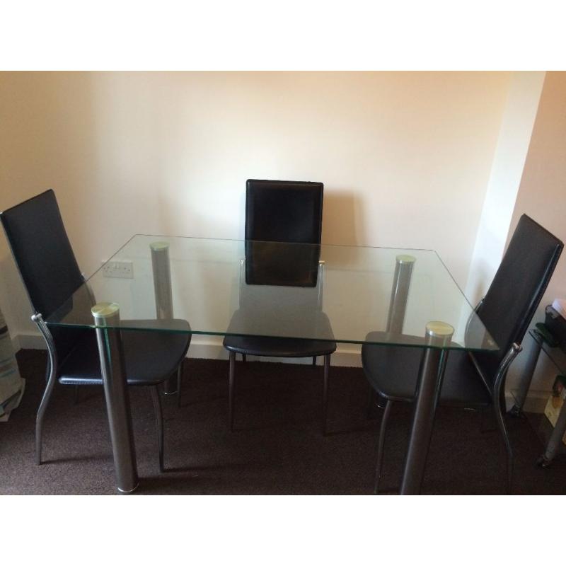 Glass table and 4 chrome and leather look chairs