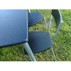 Four black chairs and table