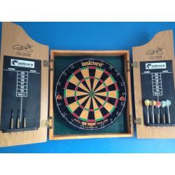 Dart board with darts