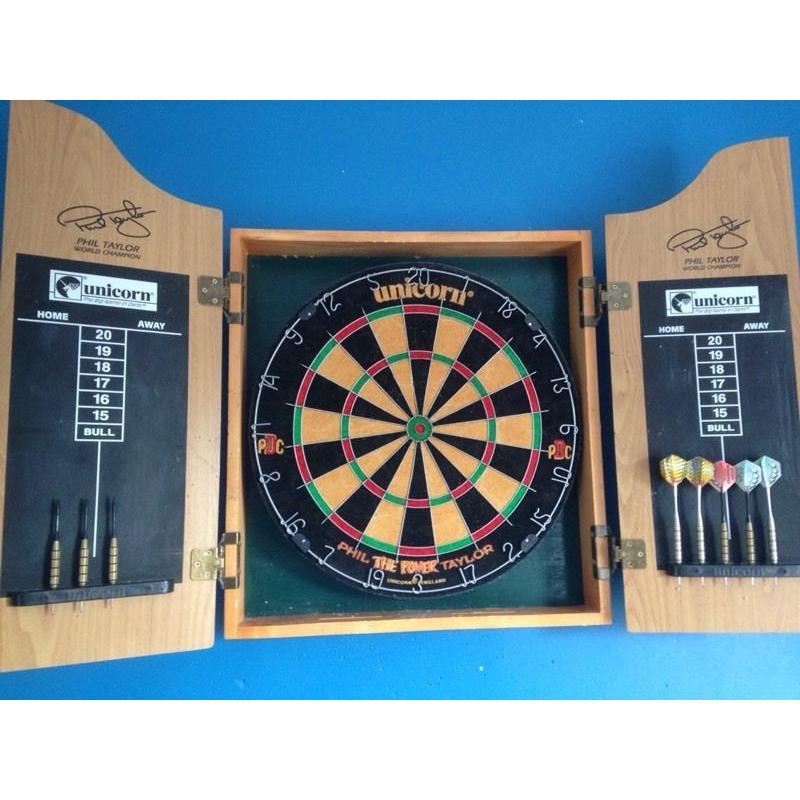 Dart board with darts