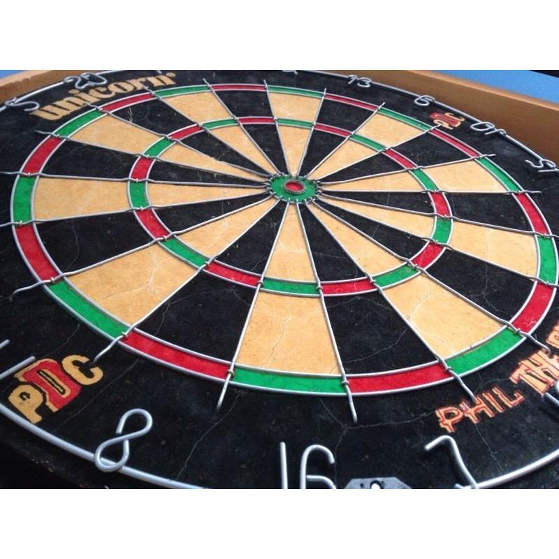 Dart board with darts