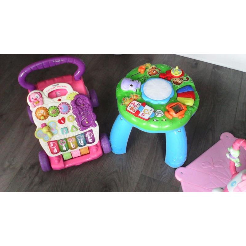 Bundle of toys zebra bouncer,leap frog activity table and vtech walker