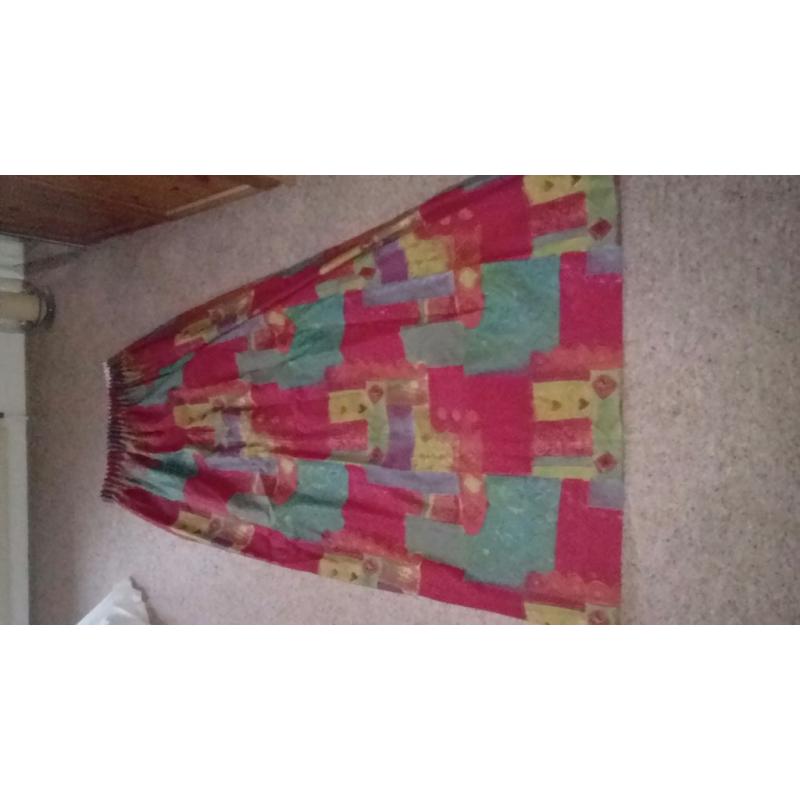 Red patterned curtains with contrasting tie-backs