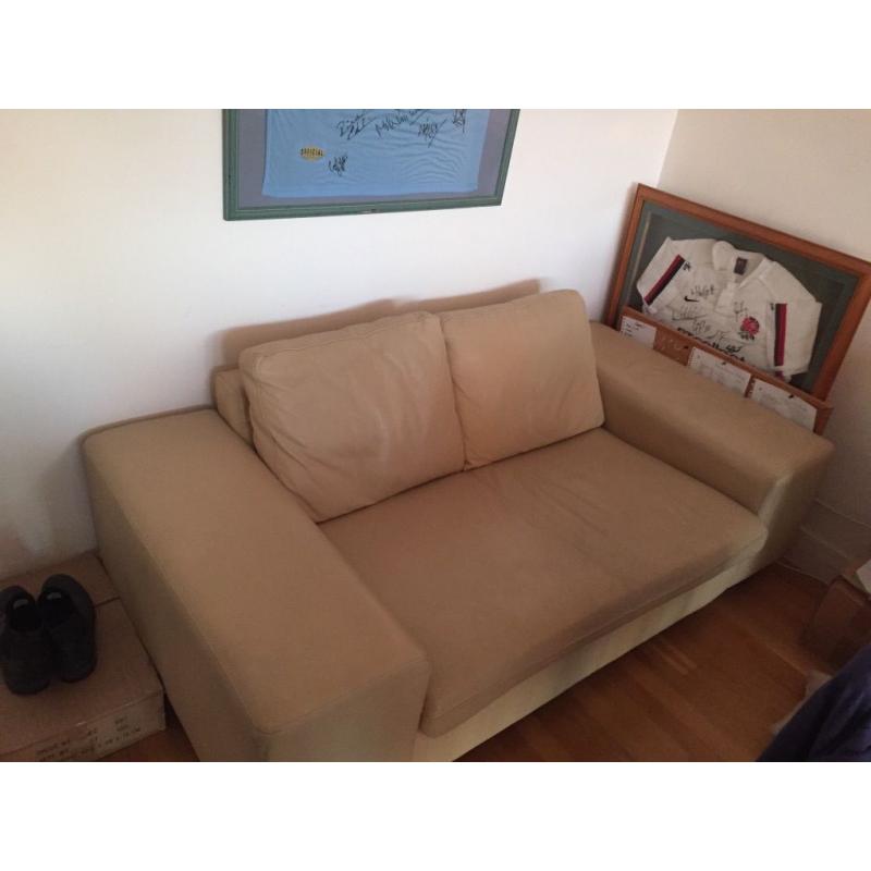 2 seater cream leather sofa in very good condition, barely used