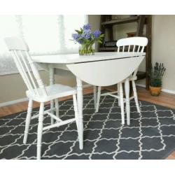 Round drop leaf table and 2 vintage farmhouse chairs