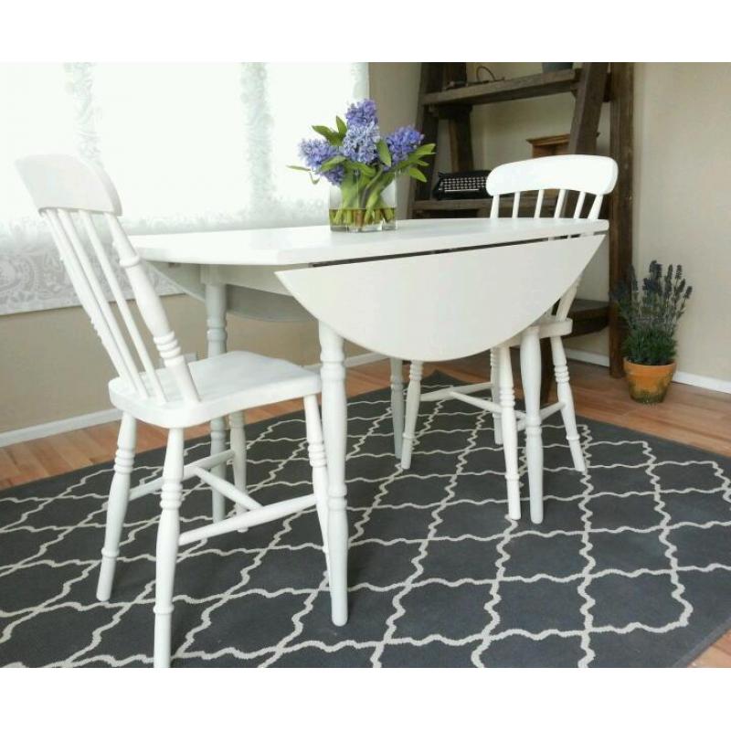 Round drop leaf table and 2 vintage farmhouse chairs