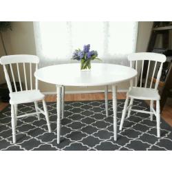 Round drop leaf table and 2 vintage farmhouse chairs