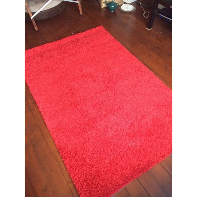 Red fluffy rug