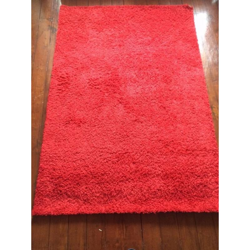 Red fluffy rug