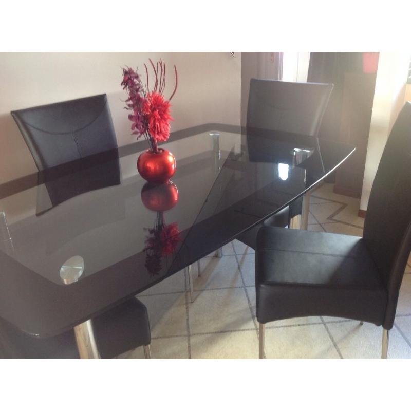 Dinning table with 4 black leather chairs