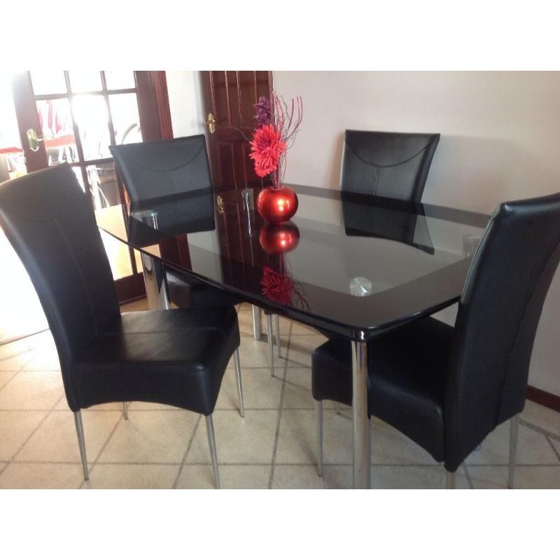 Dinning table with 4 black leather chairs