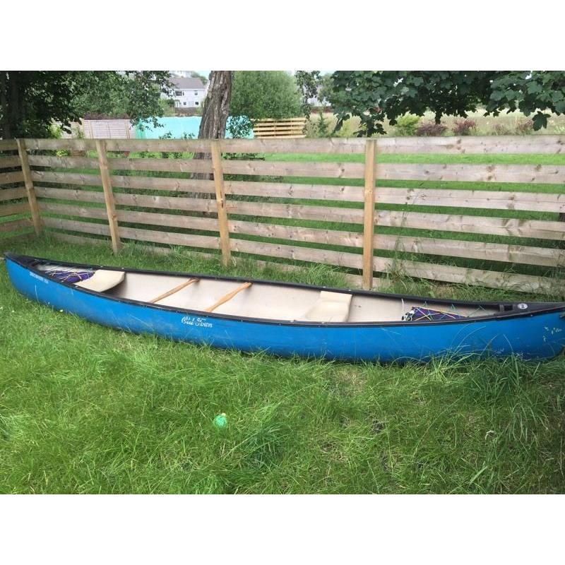 Old town canoe with river buoyancy bags and paddle