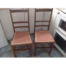 A pair of solid wood chairs for any room of the home