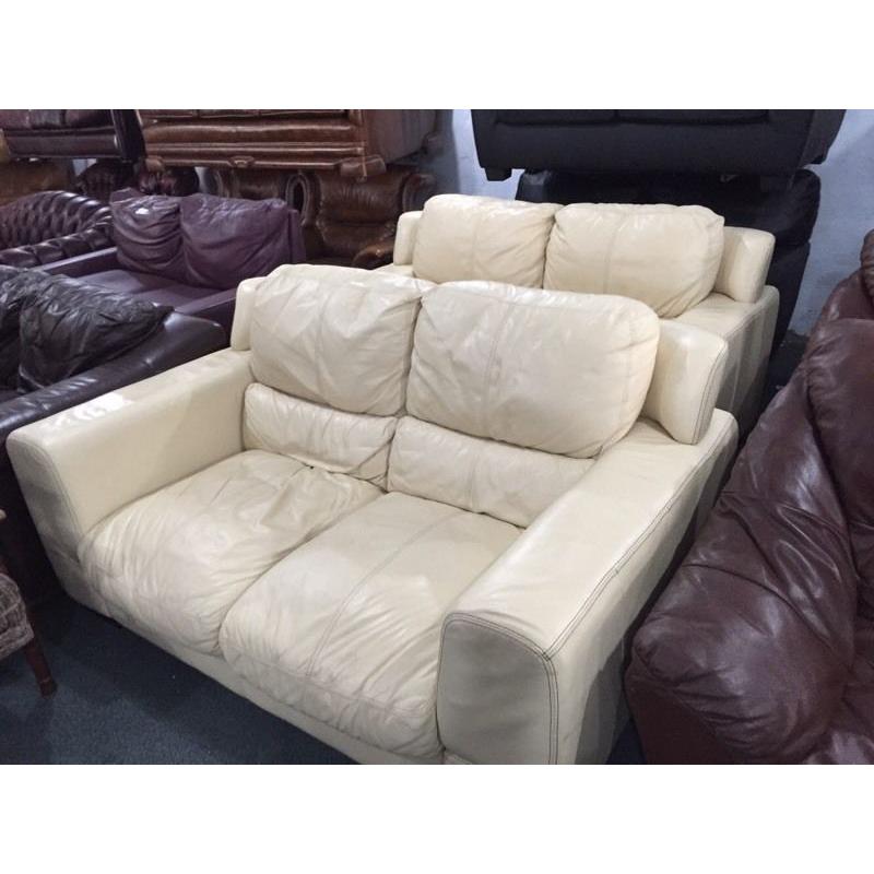 2 cream leather 2 seater sofas