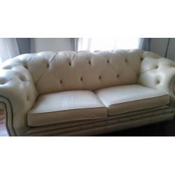 Beautiful cream leather chesterfield sofa.