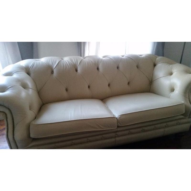 Beautiful cream leather chesterfield sofa.