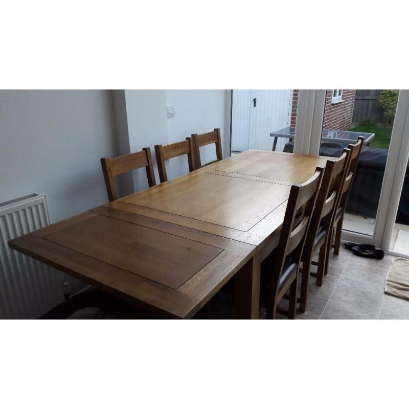 Solid Oak Dining Table with 6 chairs, only 2 years old. Great condition!