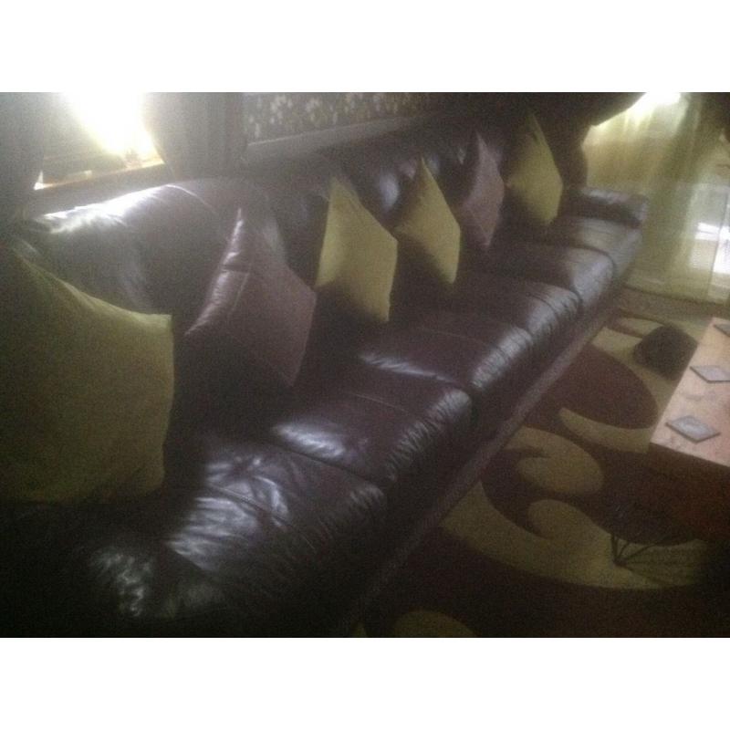 Leather 6 seater Sofa and Chair . Chocolate Brown .Sofa splits in 2 for moving .