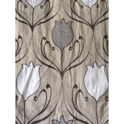 Lined eyelit patterned curtains