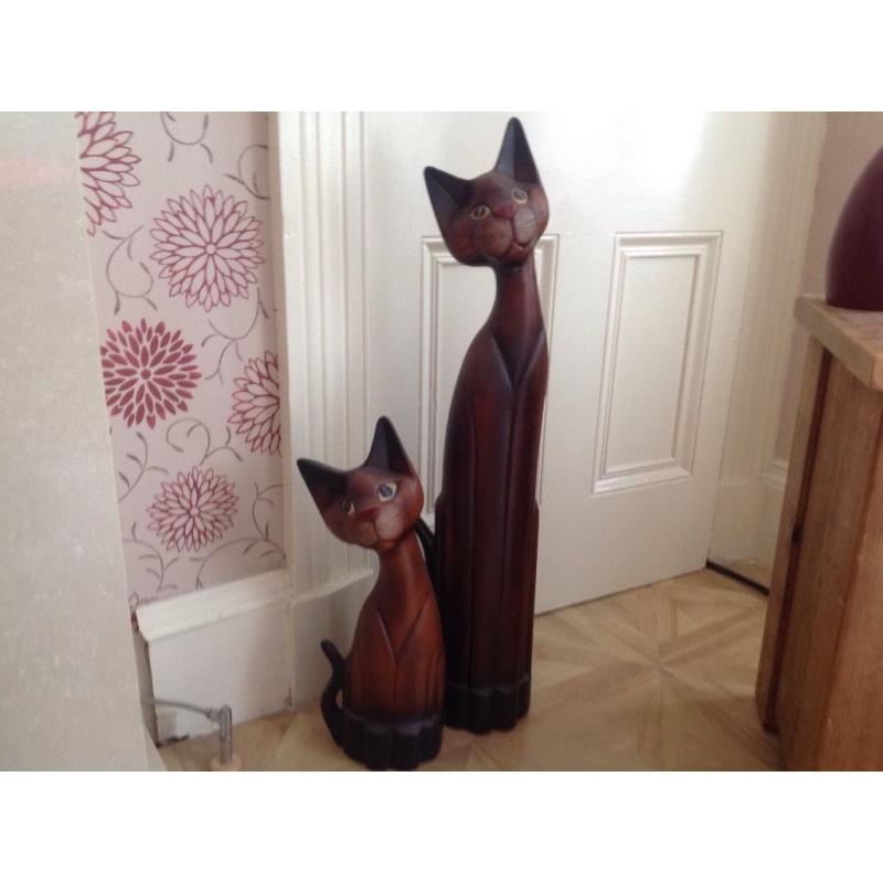 Wooden cats. Two wooden cats for sale cheeky smile