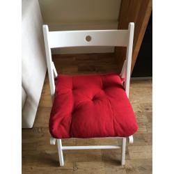 4 White IKEA chairs with red cushions