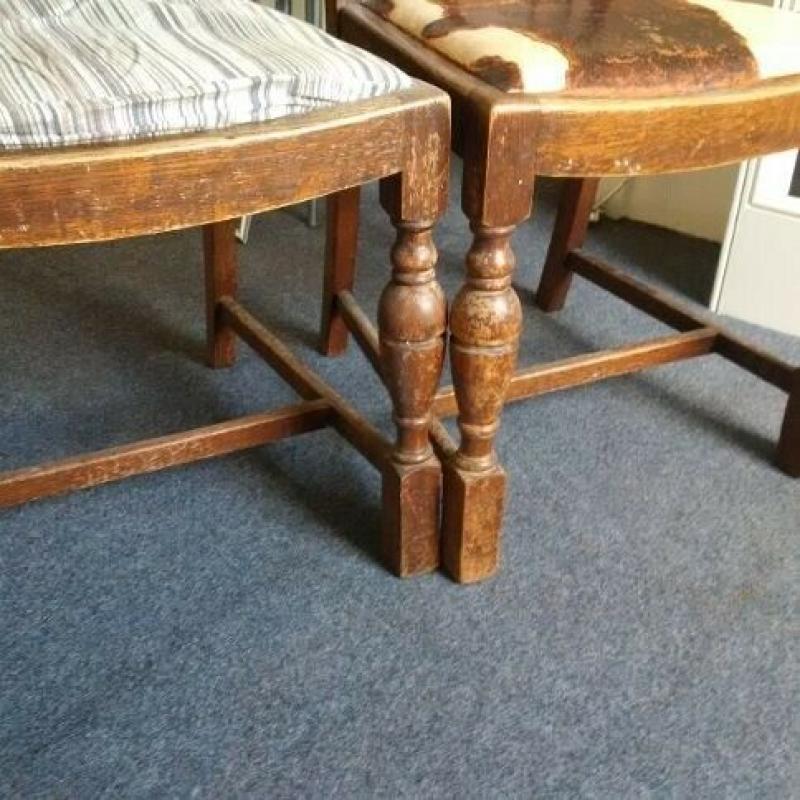 two vintage solid oak chairs with nice detail and patina