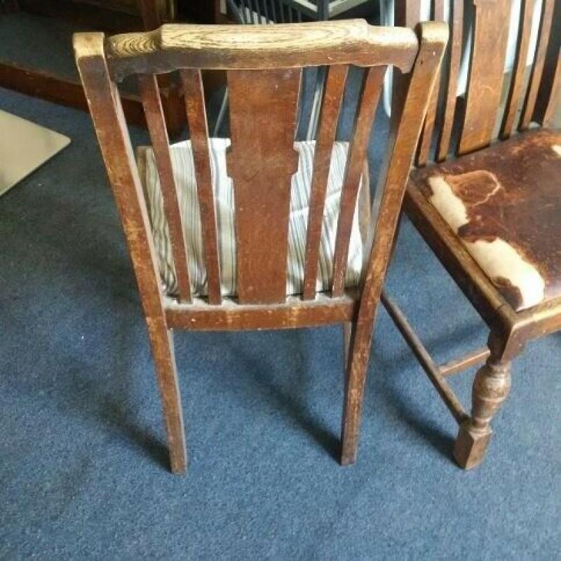 two vintage solid oak chairs with nice detail and patina